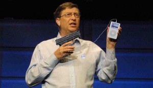 Bill Gates points gun at an iPod