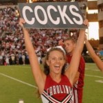 South Carolina cheerleader with Cocks sign